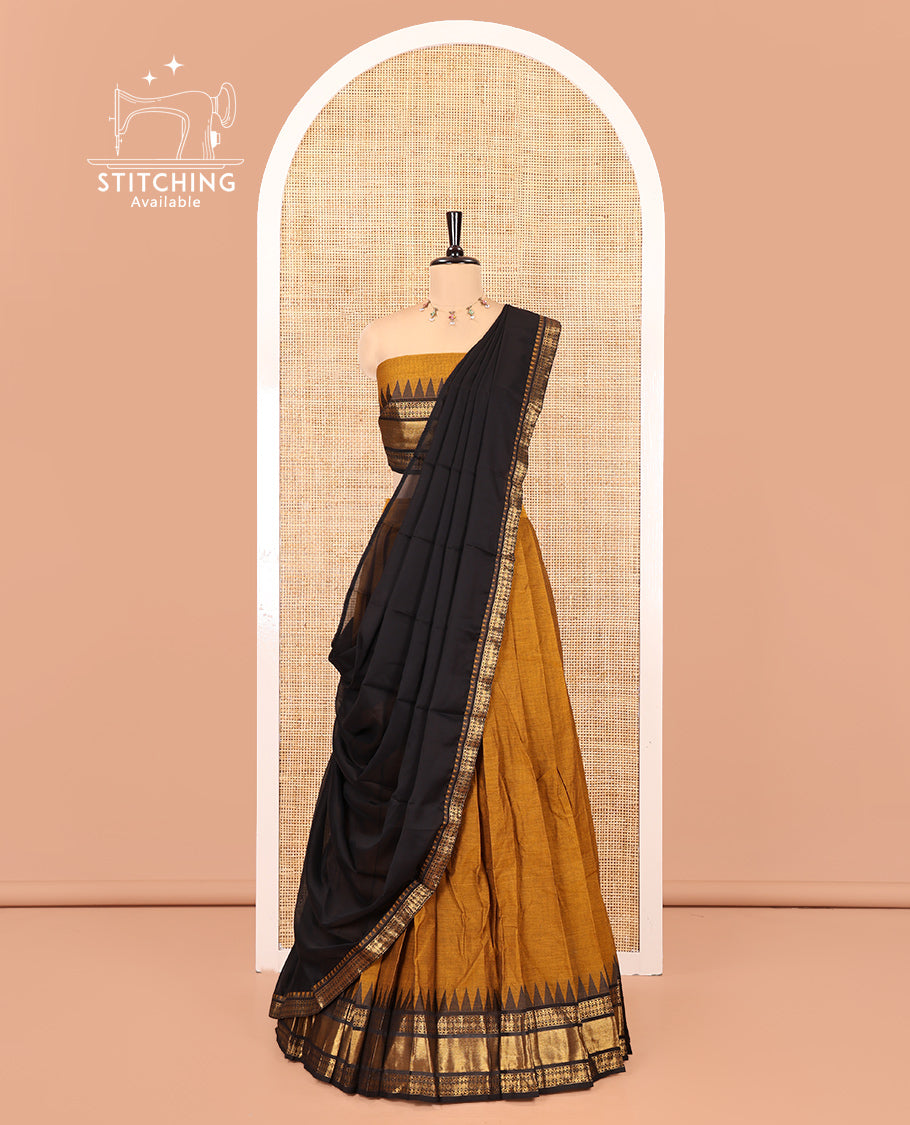 Mustard-Black Chettinad Cotton Half-Saree Set Featuring a Plain Skirt, Contrast Temple Traditional Design Border, a Matching Blouse, and a Contrast Zari-Bordered Dhavani