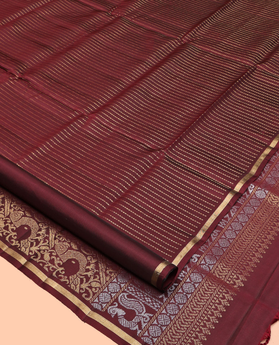 Maroon Mayuri Lite Silk Mix Saree, Highlighted by Muthu Zari Stripes, a Subtle Piping Border, Pallu Steeped with Parrot Designs, and a Matching Blouse