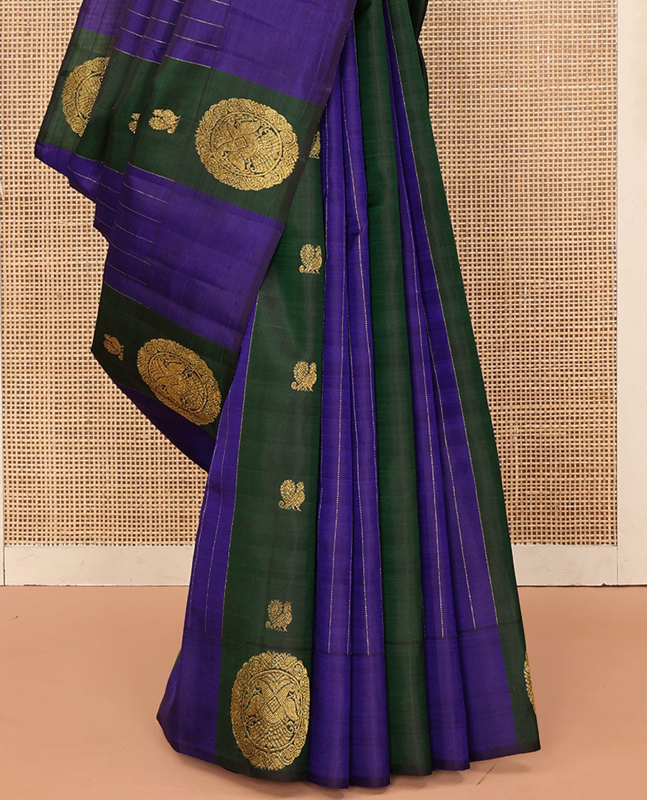Blue and Green Striped Kanchipuram Silk Saree, Beautifully Bedecked with Muthu Stripes, Mayil, and Round Iruthaipakshi Motifs All Over Its Body, Grand Pallu of Triangle Motifs, and Paired with a Contrast Blouse