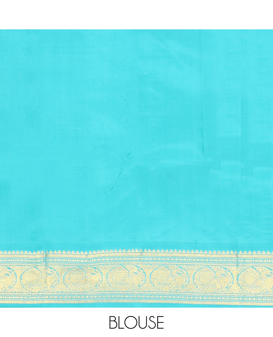 Purple Vasundhara Silk Saree, Subtly Sparkled With Zari Buttas All Over Its Body, Complemented by Zari Buttas All Over Its Body, Complemented by Contrast Border of Thilakam, Banaras, and Mayil Designs Grand Jaal Pallu and Paired with a Contrast Blouse