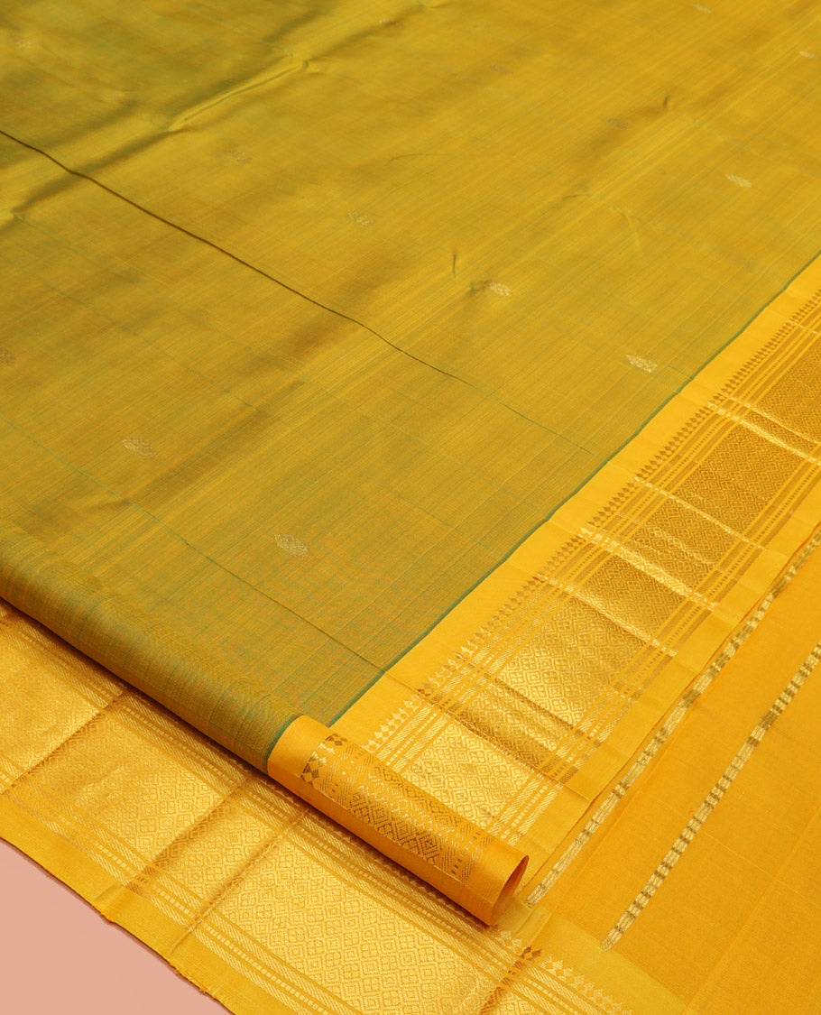 Green Kanchipuram Silk Saree, Woven with Zari Buttas, a Contrast One-Sided Border of Panner Sombu, Banaras, Muthu, and Jaal Design, Zari-Woven Pallu, and No Blouse