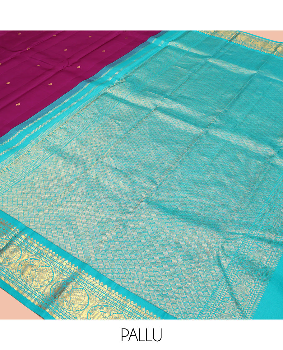 Purple Vasundhara Silk Saree, Subtly Sparkled With Zari Buttas All Over Its Body, Complemented by Zari Buttas All Over Its Body, Complemented by Contrast Border of Thilakam, Banaras, and Mayil Designs Grand Jaal Pallu and Paired with a Contrast Blouse