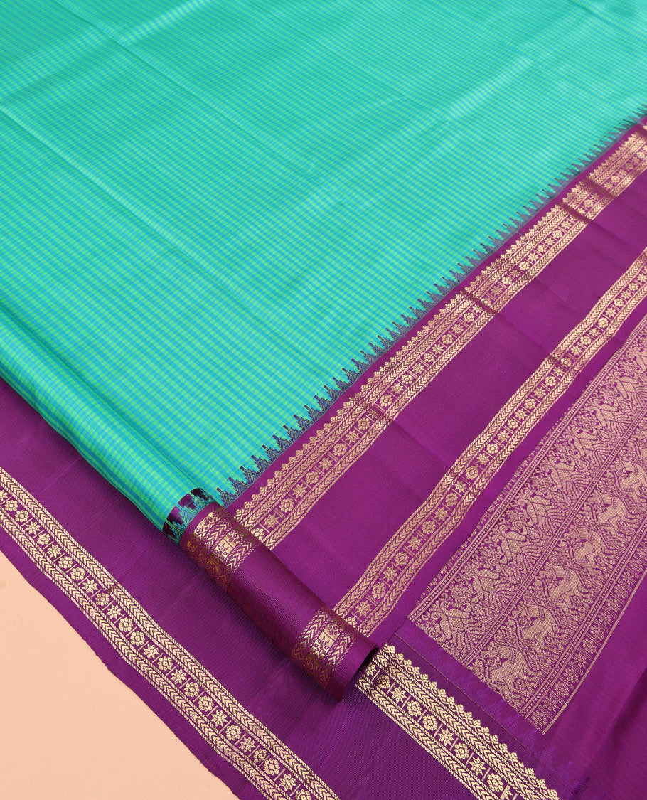 Turquoise Checked Vasundhara Silk Saree, Contrast Rettai Pettu Border of Rekku, Salngai, Kathir, Banaras, Star Vanki, and Kamalam, Pallu of Iruthalai Pakshi, and Yaali, and a Contrast Blouse