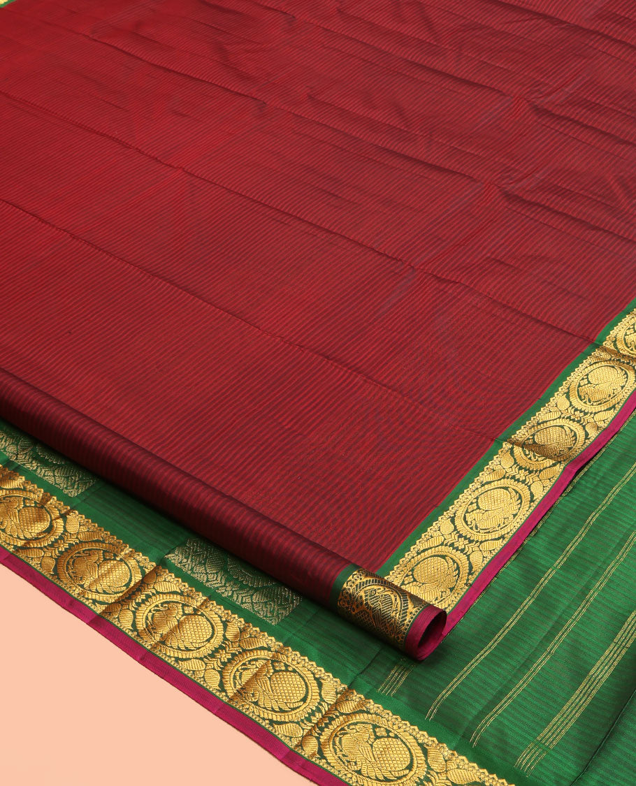 Maroon Kanchipuram Silk Saree, Elevated with Vazhaipoo Stipes and Zari Buttas, a Contrast Traditional Mayil Motif Border, Pallu of Zari Design, and Contrast Blouse