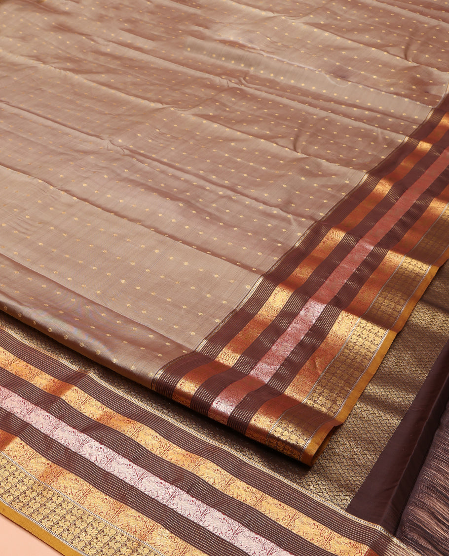 Grey Vasundhara Lite Silk Mix Saree, Elegantly Decked up with Zari Buttas on Its Body, Complemented by a Contrast Border of Muthu, Stripes, Yaali, and Mayil Designs, Intricately Designed Pallu, and Paired with a Contrast Blouse