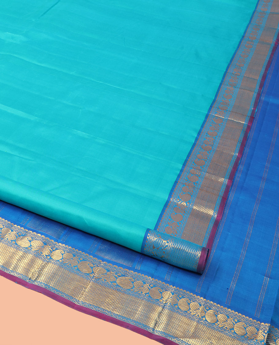 Blue Plain Kanchipuram Silk Saree, Complemented by Contrast Border of Salngai, Muthu, Rekku, Manga, Mayil, and Zari Stripes, Subtly Sparkled Pallu, and Paired with a Contrast Blouse