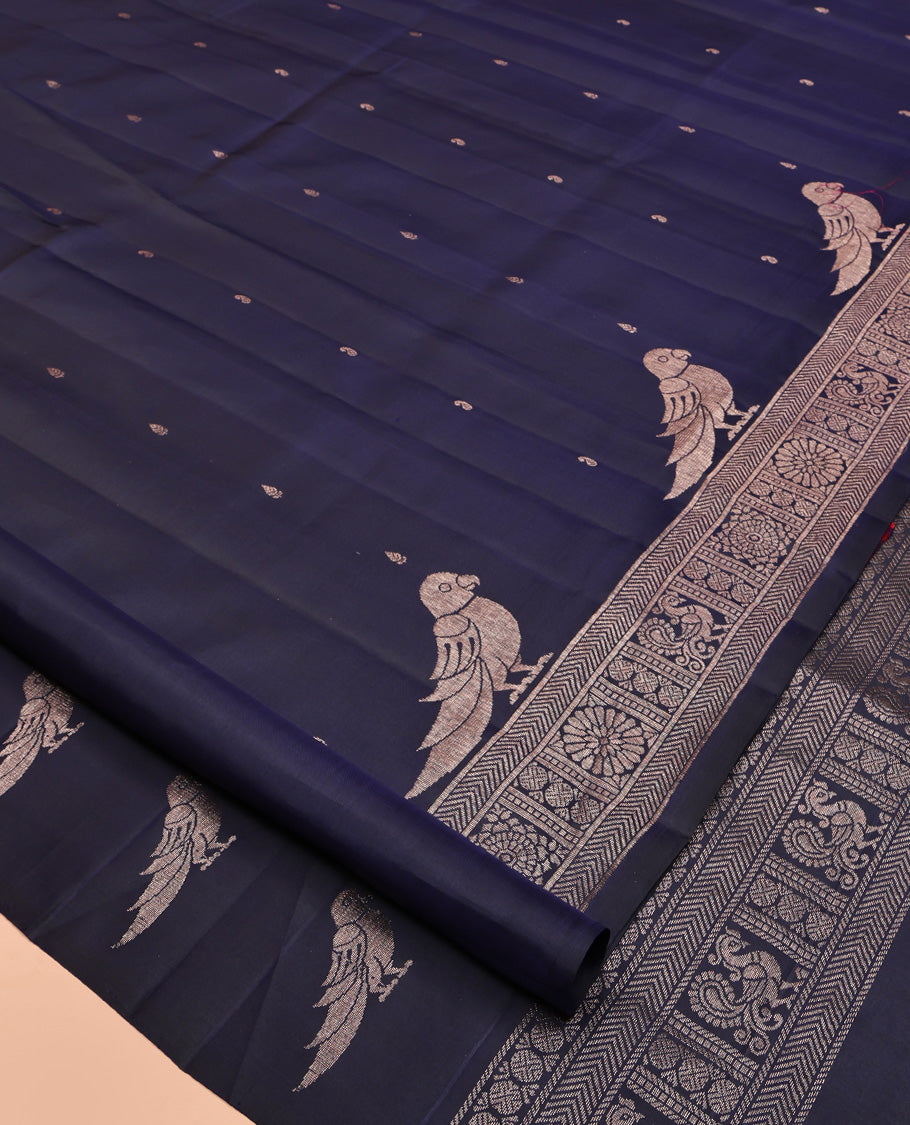 Blue Mayuri Soft Silk Saree, Finely Crafted with Buttas All Over Its Body, Highlighted by Self-Border of Parrot, Chakram, and Mayil Designs, Pallu Steeped with Parrot Designs, and Paired with a Matching Blouse