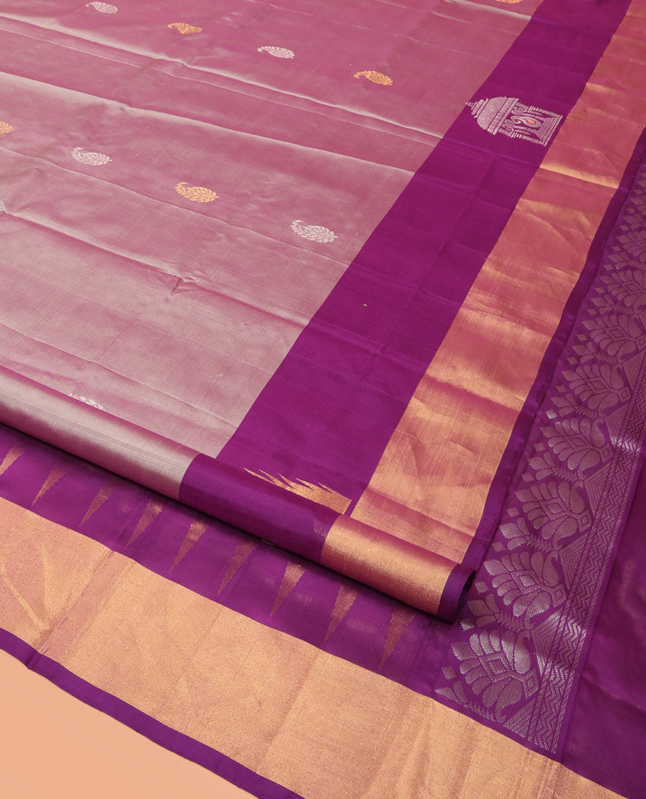 Pink Uppada Silk Saree Spotlighted with Paisley Buttas All Over Its Body, Complemented by Contrast Border of Temple and Chariot Designs, Grandly Woven Pallu of Temple Floral Vine Designs, and Paired with a Contrast Blouse
