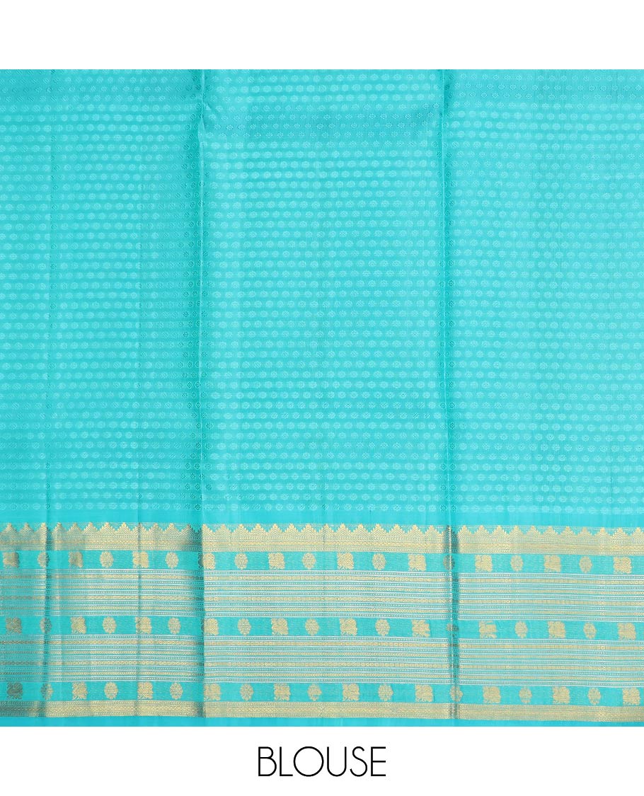 Orange pure-silk half-saree, buttas with a contrast mayil chakram bordered skirt, contrast blouse, and a leaf jaal dhavani