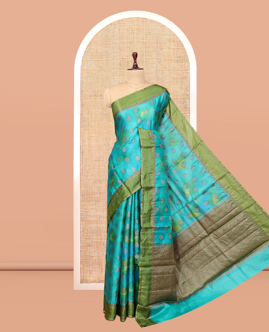 Blue Tussar Silk Saree Features Buttas, Complemented by a Contrast Traditional Zari Border, Intricately Designed Pallu, and a Contrast Blouse