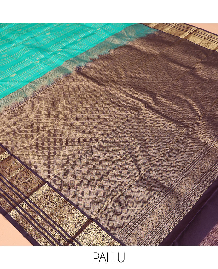 Turquoise Vasundhara Silk Saree, Accentuated with Zari Checks, a Contrast Border of Thilakam Mokku, Mayil, Neli, and Kamalam Designs, a Grand Jaal Pallu, and a Contrast Blouse