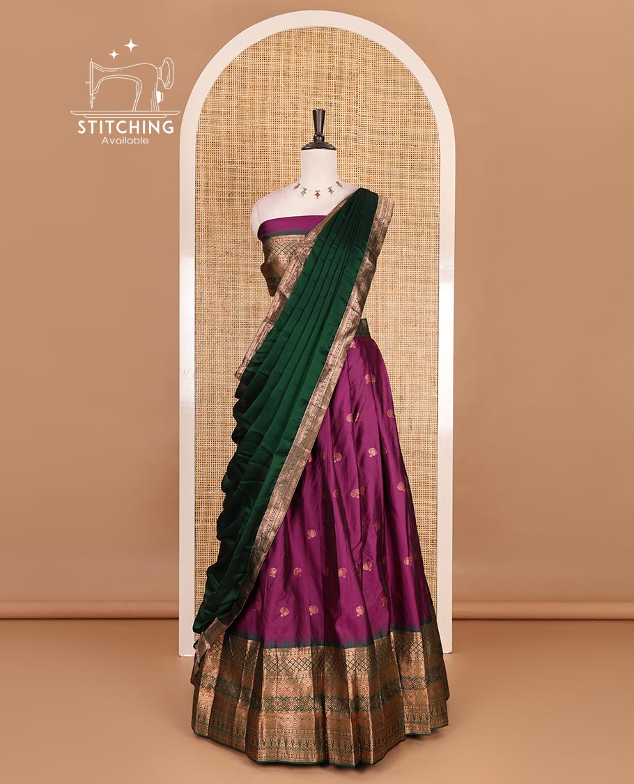 Purple taffeta silk half saree, zari buttas with contrast green traditional zari border, matching zari blouse, and contrast plain zari border dhavani