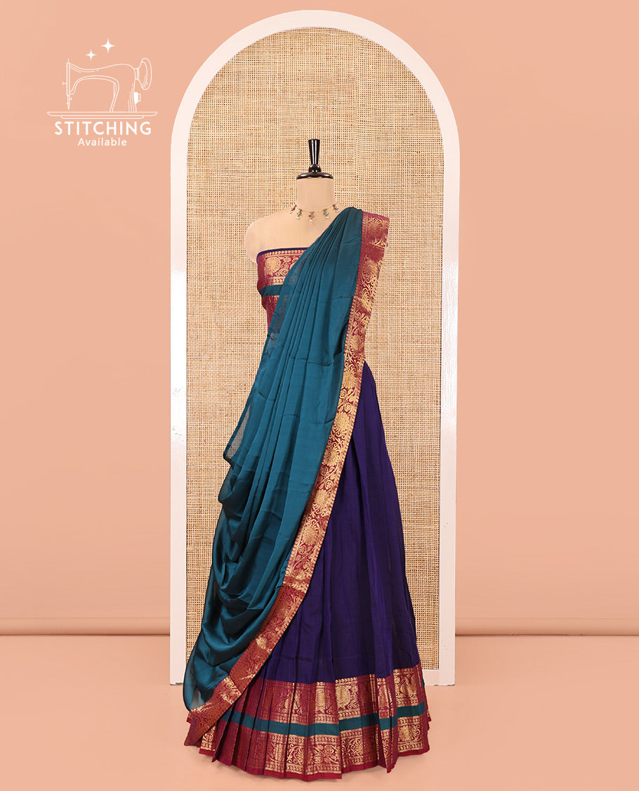 Deep Violet-Rama Mercerised Cotton Half-Saree Features Plain with Contrast Peacock and Floral Creeper Zari Bordered Skirt, Paired with a Matching Blouse, and Comes with a Contrast Floral Creeper Zari Bordered Dhavani