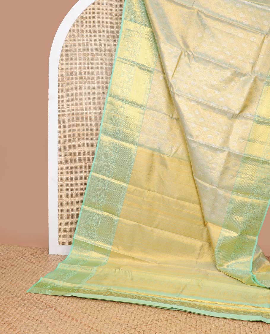 Mint green floral design kancheepuram tissue silk saree with contrast border of intricate zari design border & argyle design pallu