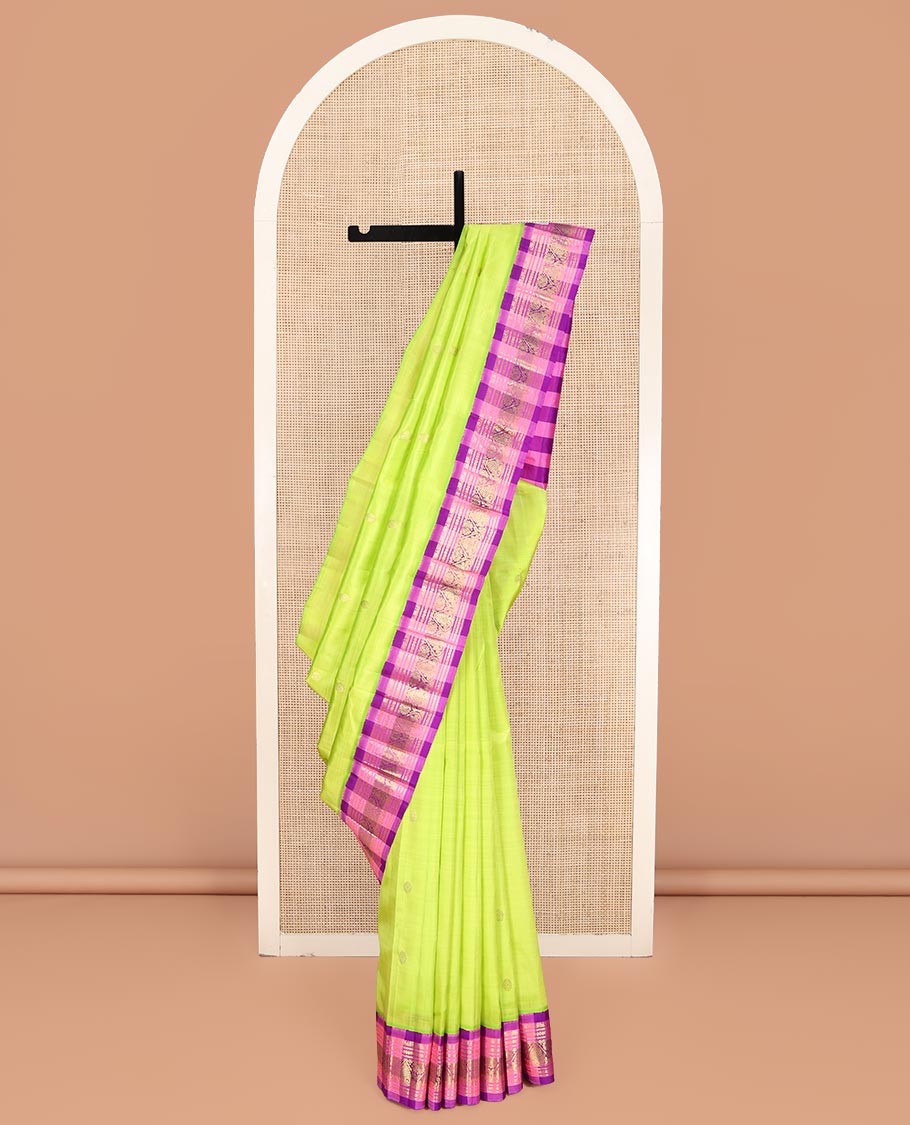 Green Kanchipuram Silk Saree, Embellished with Zari Buttas on Its Body, Complemented by a Contrast One-Sided Korvai Checked Border of Zari Designs, Pallu Features Zari Designs, and Comes Without a Blouse
