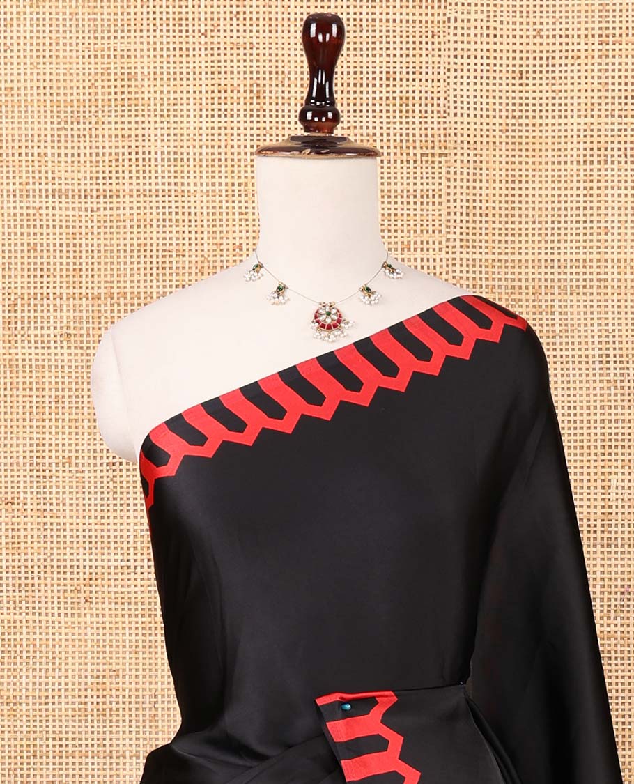 Black plain gajji silk saree features a temple-printed border, a circular-shaped vine-patterned pallu, and a unique motif-printed blouse