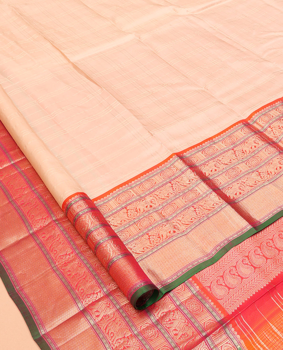 Sandal Vasundhara Silk Saree Subtly Sparkled with Zari Checks, Complemented by a Contrast Border of Thilakam Mokku, Chakram, Kodi Yaanai, Kuthirai, and Mayil Kann, Intricately Designed Pallu, and Paired with a Contrast Blouse