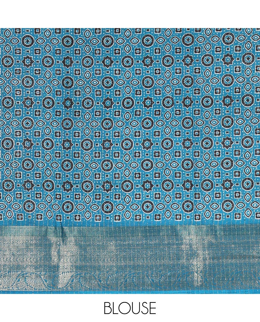 Cream-rama blue zari striped dola silk saree, contrast traditional zari border of leaf creeper, Ajrakh printed pallu, and Ajrakh printed blouse