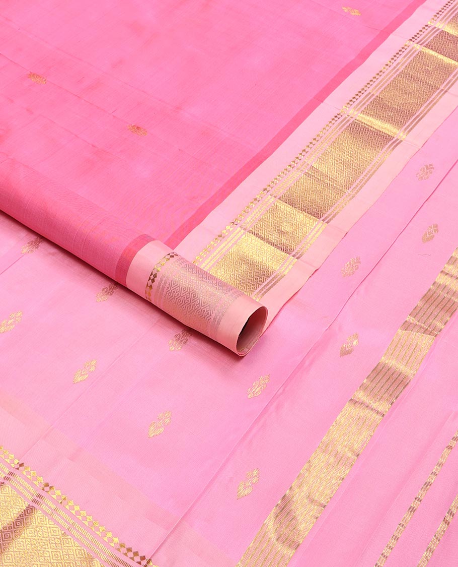 Baby pink buttas kancheepuram silk saree with contrast border of thilakam mokku, banras, checked design & zari design pallu