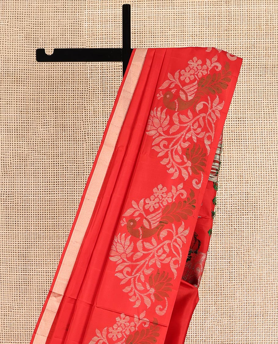 Red Mayuri Soft Silk Saree, Subtly Sparkled with Buttas, Highlighted by a Self-Border of Floral and Peacock Design, Pallu Mirrors the Same Design, and a Matching Blouse