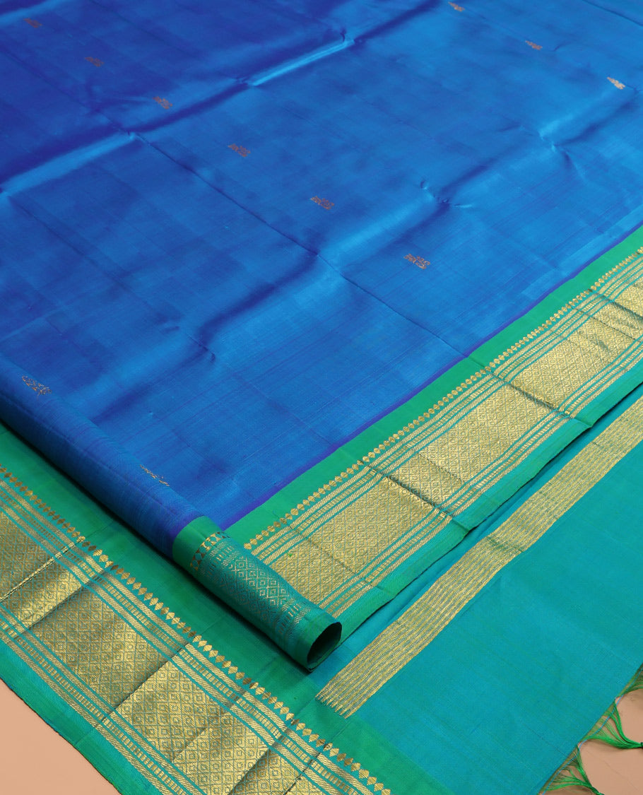 Blue Kanchipuram Silk Saree, Woven with Zari Buttas, a Contrast One-Sided Border of Rekku, Banaras, Muthu, and Mayil Kann Designs, Zari Design Pallu, and No Blouse