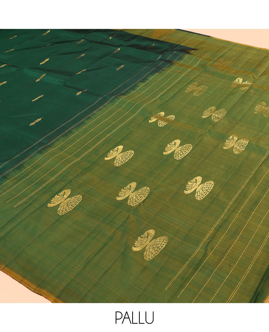 Green Kanchipuram Silk Saree, Highlighted by Zari Buttas, a Contrast Thazampoo Rekku Border, Zari Design Pallu, and a Contrast Blouse