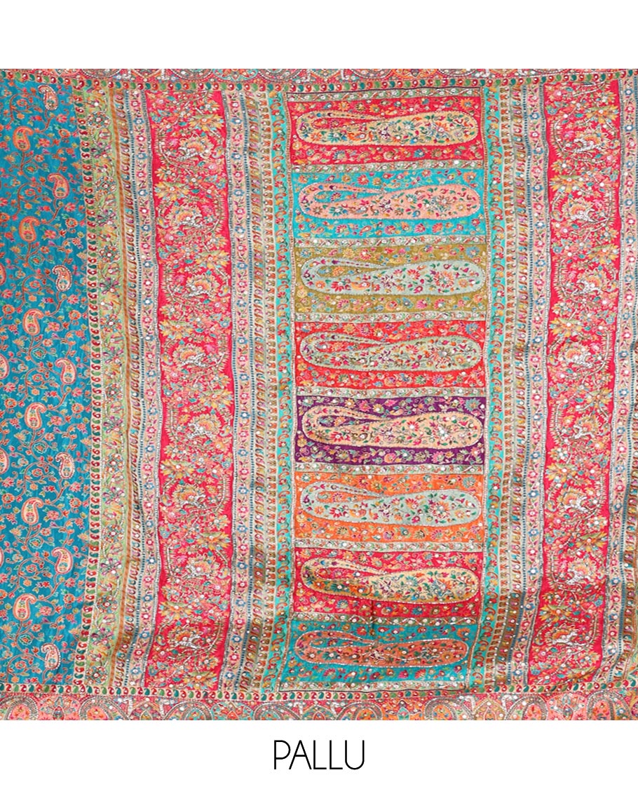Blue Dola Silk Saree, Opulently Embellished with Colorful Floral-Paisley Design on Its Body, Highlighted by Print and Embroidery Border, Colorfully Decked Up Pallu, and Paired with a Contrast Blouse