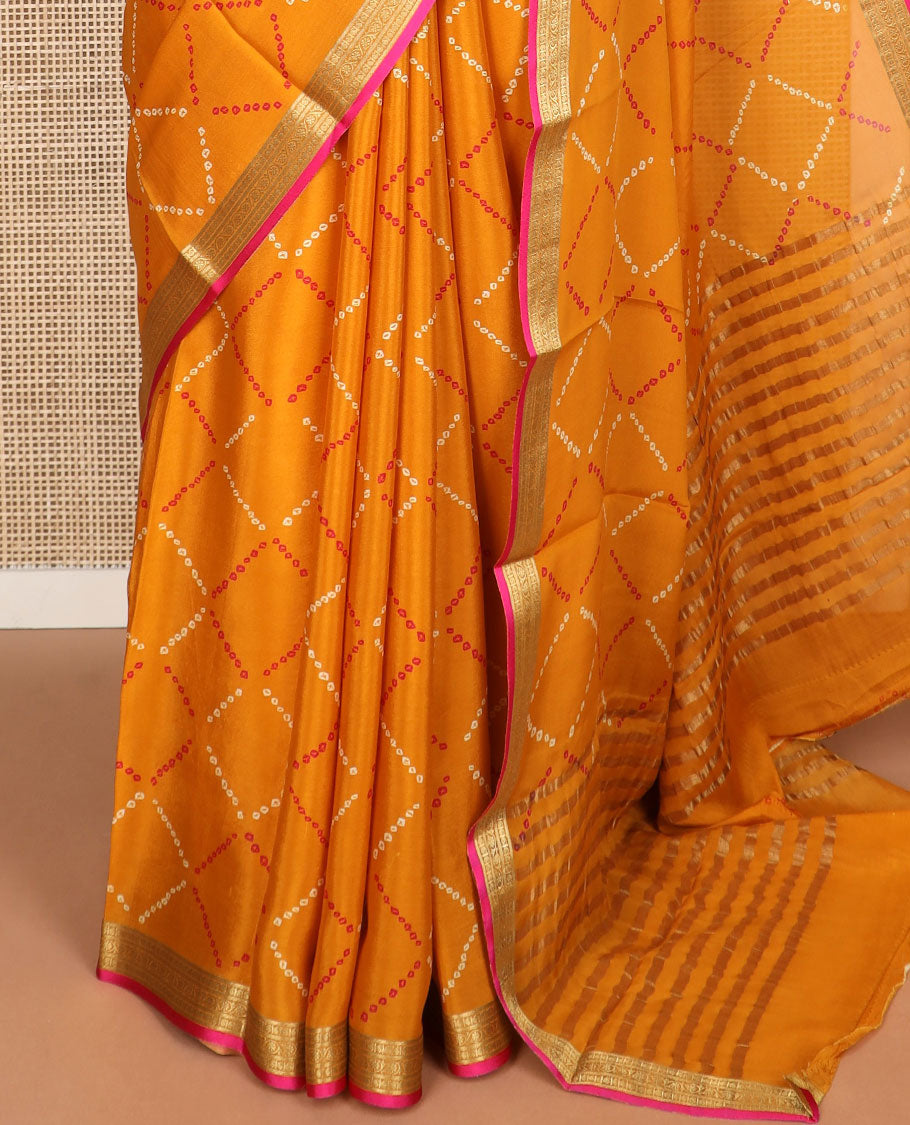Orange bhandani style design crepe saree with contrast zari border & striped pallu