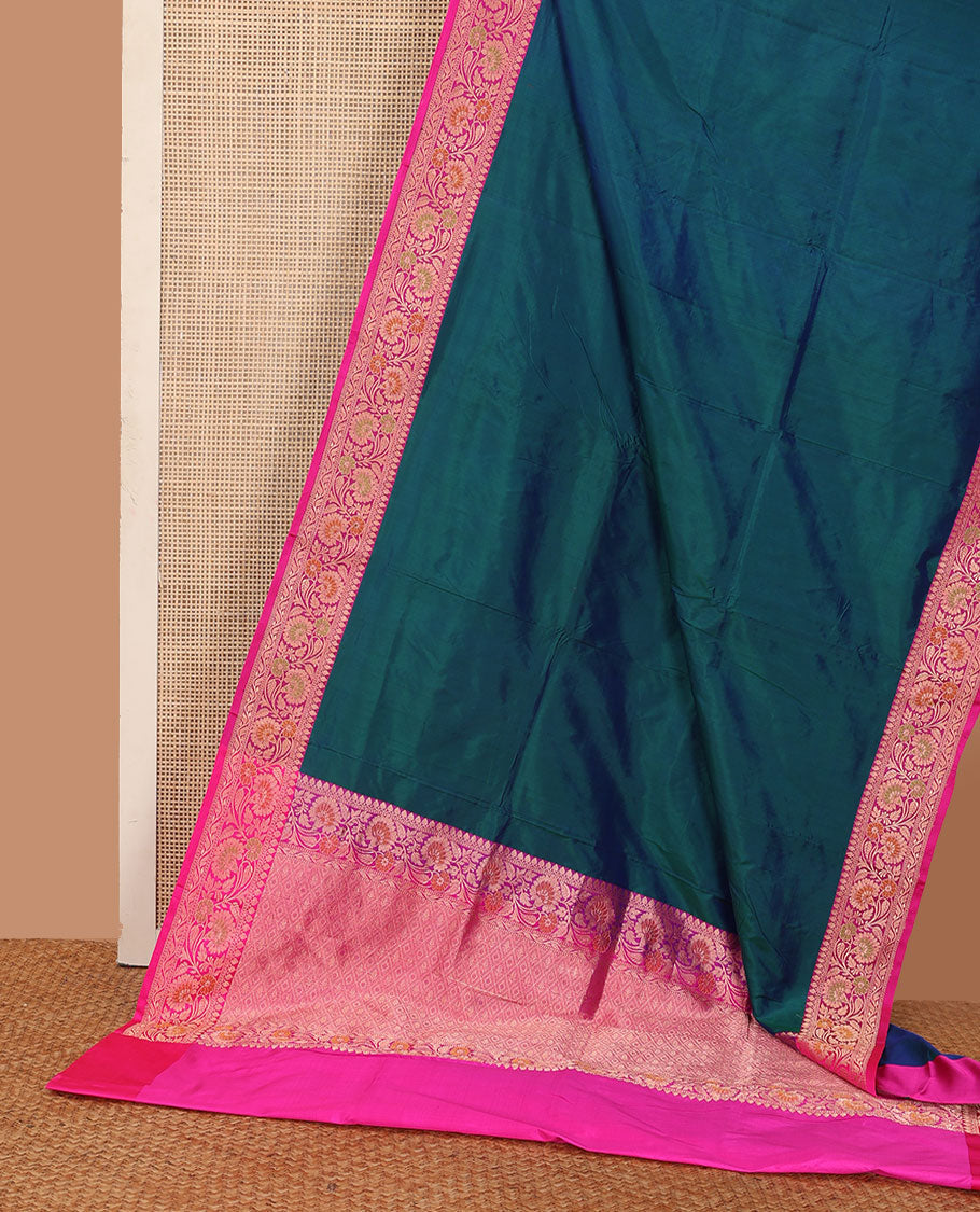 Peacock blue plain katan silk saree, contrast floral creeper border, and pallu of jaal deisgn