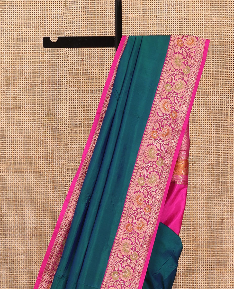 Peacock blue plain katan silk saree, contrast floral creeper border, and pallu of jaal deisgn