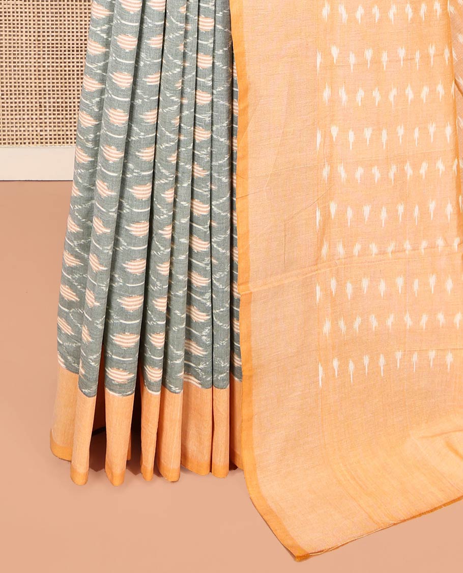 Grey Ikkat Cotton Saree, Accentuated with Ikkat-Style Ogee Patterns on Its Body, Complemented by Contrast Border, Pallu Steeped with Buttas, and Has No Blouse