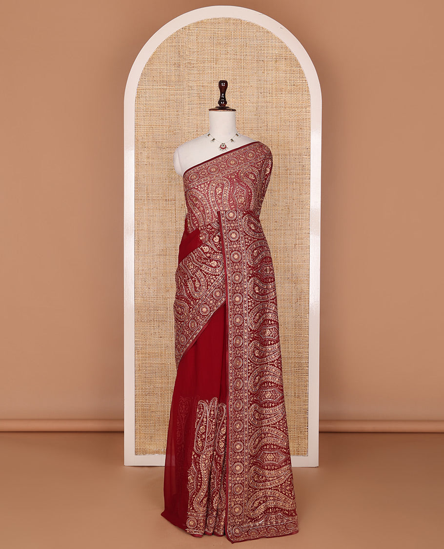 Light maroon base antique gold thread embroidered designer saree features Mughal style floral, and paisleys