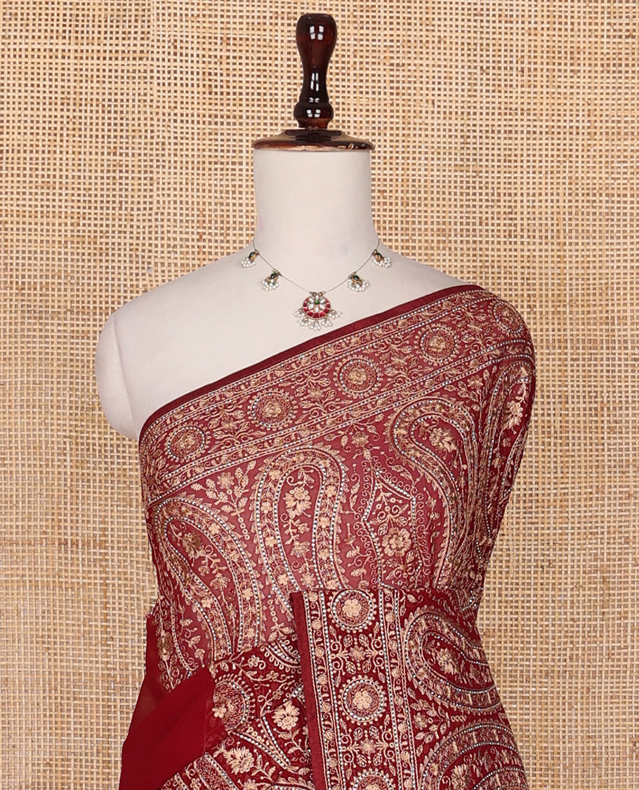 Light maroon base antique gold thread embroidered designer saree features Mughal style floral, and paisleys