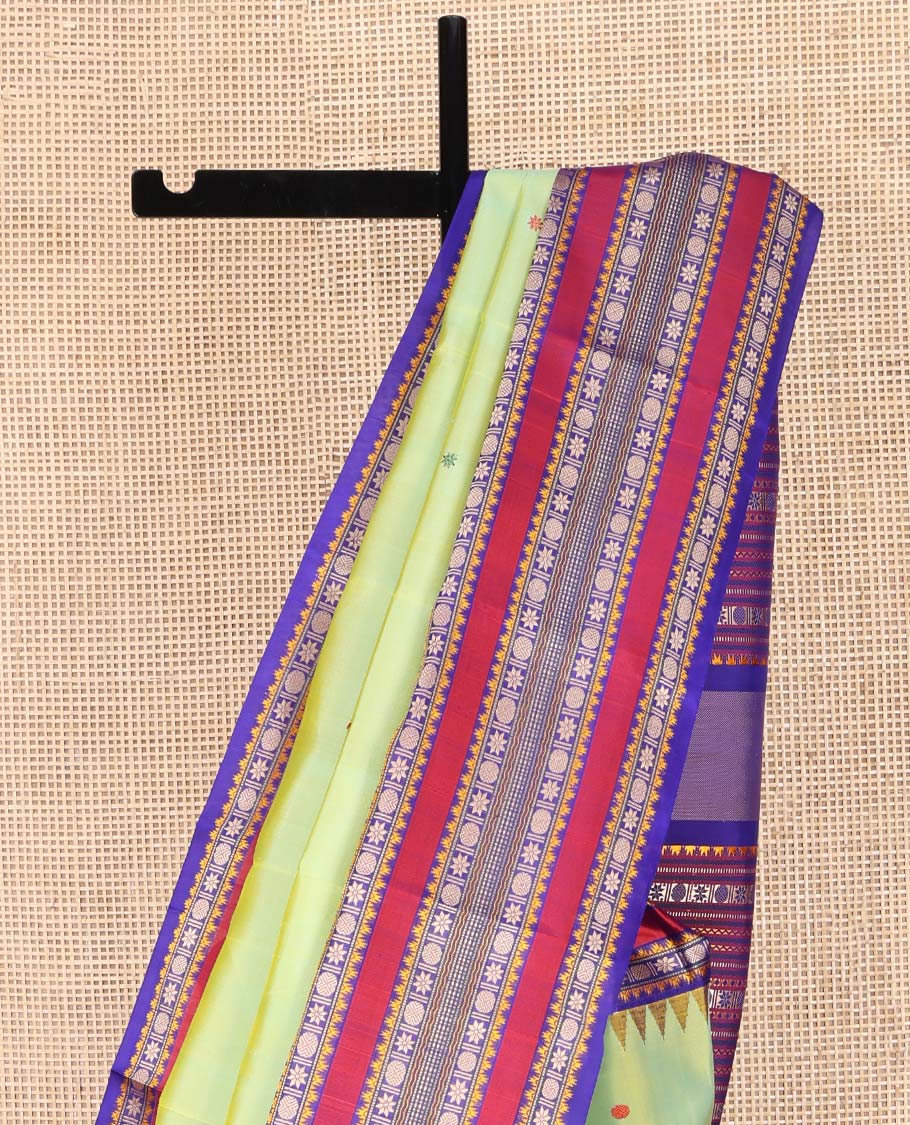 Green Kanchipuram Silk Saree, Beautifully Bedecked with Thread Buttas All Over Its Body, Complemented by a Contrast Border of Thazampoo Rekku, Muthu, Star Vanki, and Rudraksham Designs, Seppu Rekku Pallu, and Paired with a Contrast Blouse