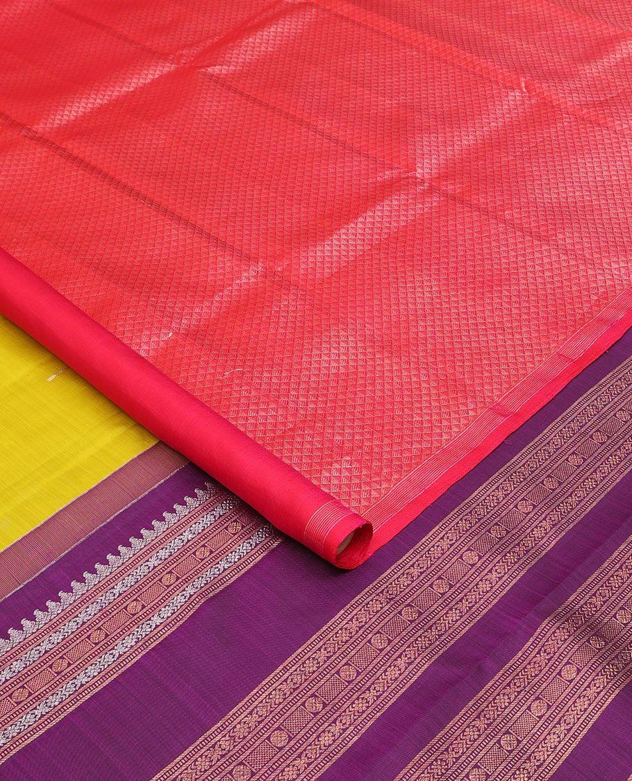 Borderless green-pink half-and-half Kanchipuram silk saree features floral meena buttas, and ara maadam design, contrast traditional motifs zari woven pallu