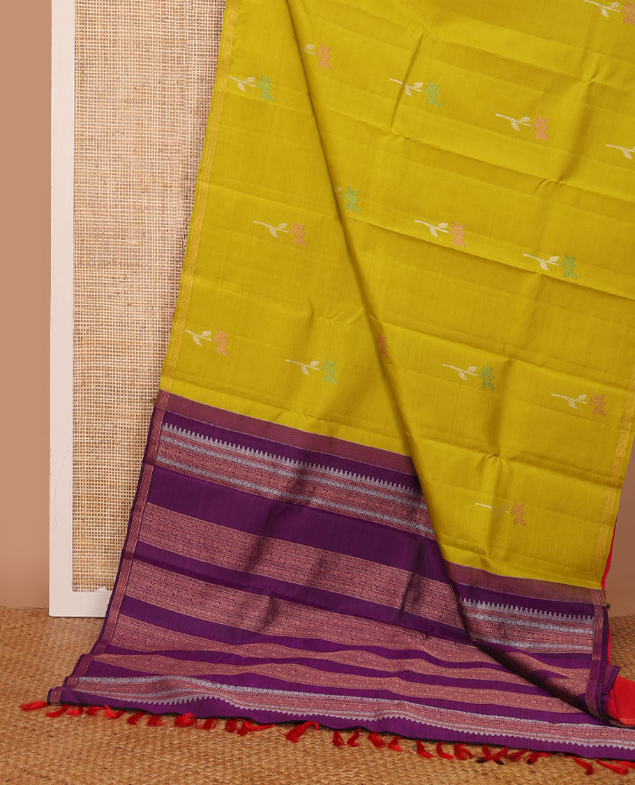 Borderless green-pink half-and-half Kanchipuram silk saree features floral meena buttas, and ara maadam design, contrast traditional motifs zari woven pallu