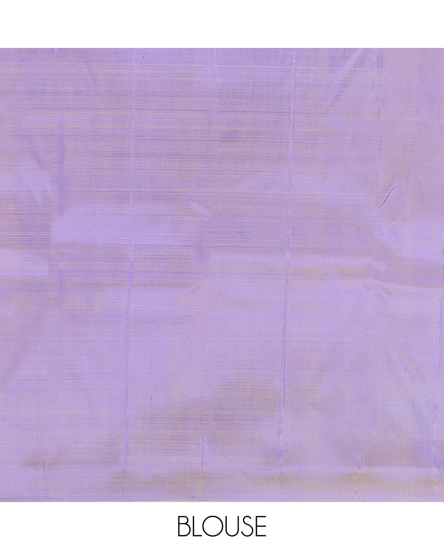 Blue Kanchipuram Silk Saree Featuring All-Over Zari Buttas, Highlighted by a Contrast Border with Manga Zari Buttas, and a Pallu Adorned with Mayil Motifs, Paired with a Subtle Contrast Plain Blouse