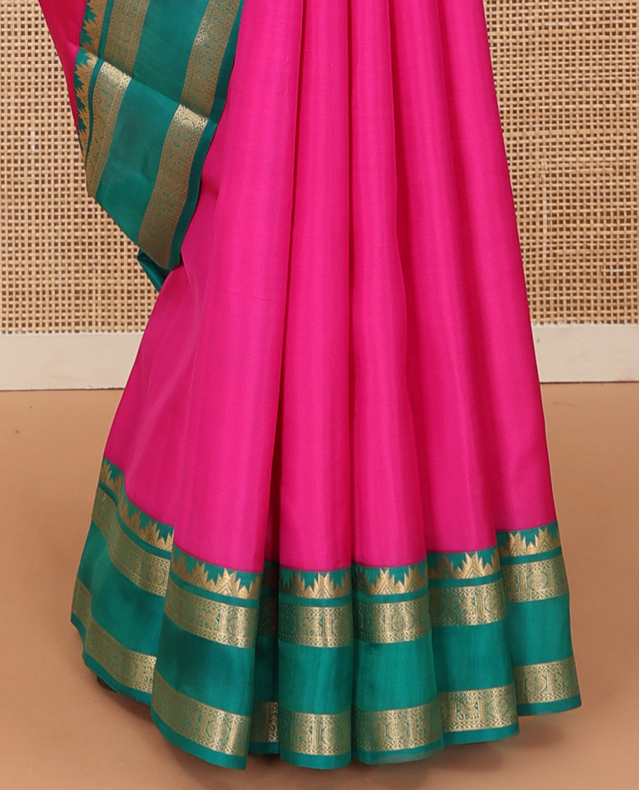 Pink plain Kanchipuram silk saree, contrast rettai pettu border of thazampoo rekku, neli, chakram, and kuthirai, and jaal pallu