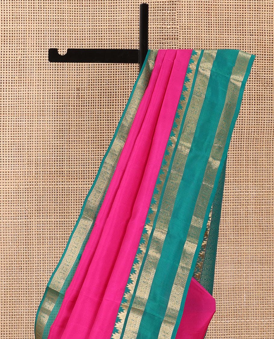 Pink plain Kanchipuram silk saree, contrast rettai pettu border of thazampoo rekku, neli, chakram, and kuthirai, and jaal pallu