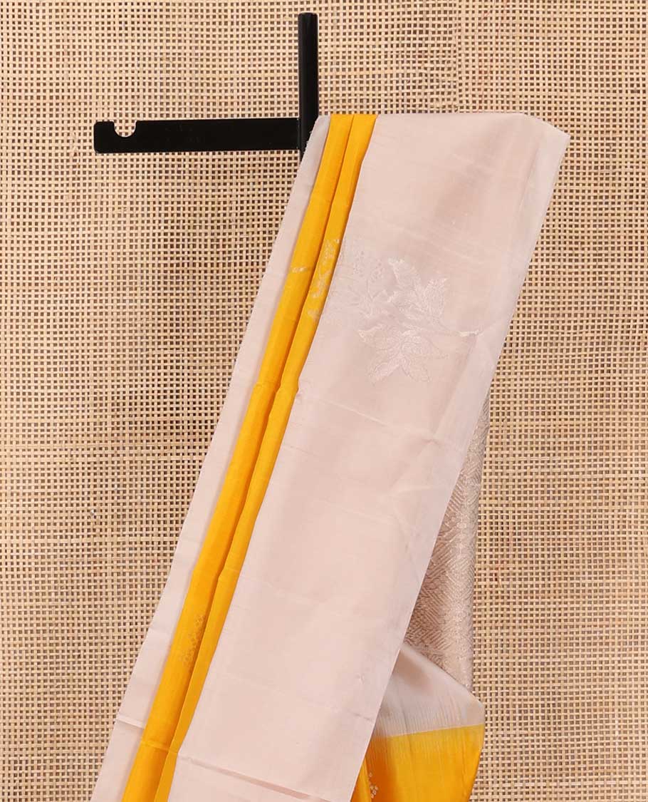 Yellow floral buttas soft silk saree, contrast border of floral buttas, and intricate pallu