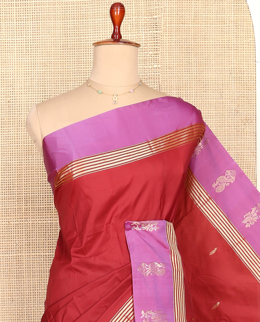 Red Aarani Silk Saree, Detailed with Zari Buttas All Over Its Body, Complemented by a Contrast Peacock Motifs Zari Border, Pallu of Stripes, and Paired with a Matching Blouse