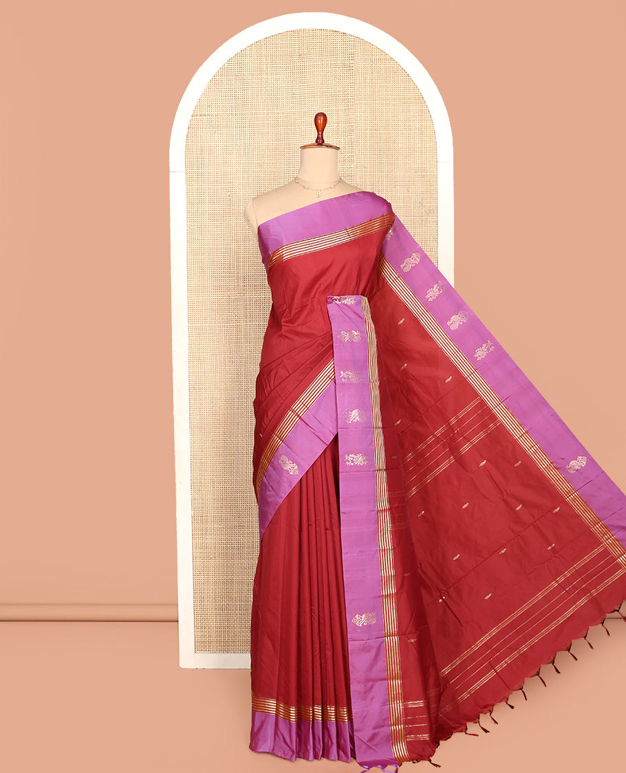 Red Aarani Silk Saree, Detailed with Zari Buttas All Over Its Body, Complemented by a Contrast Peacock Motifs Zari Border, Pallu of Stripes, and Paired with a Matching Blouse