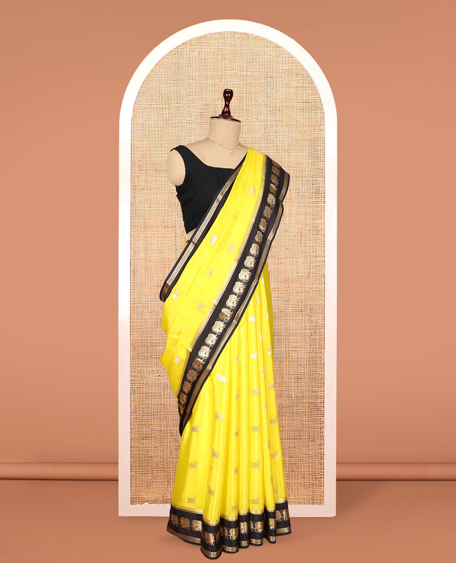 Yellow Mysore Silk Saree, Artfully Detailed with Pichwai Cow Buttas, Complemented by a Contrast Pichwai Cow Zari Border, Pallu Steeped with Pichwai Cows, and a Contrast Blouse