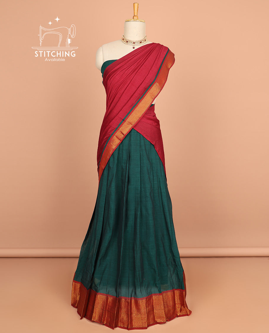 Green cotton half saree with contrast peacock motifs border, plain blouse & plain dhavani with striped design border