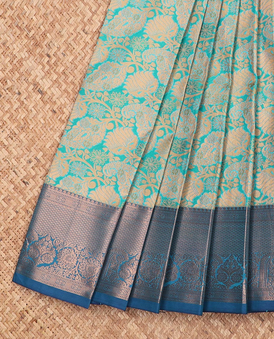 Blue jacquard gift saree, contrast traditional zari design border, and zari-rich jaal pallu