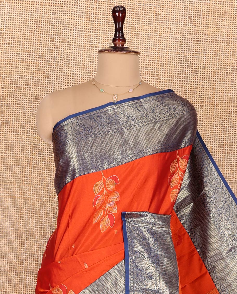 Orange Budget Silk Saree, Decked Up with Zari Buttas and Leaf Buttas on Its Body, Complemented by a Contrast Traditional Zari Designs Border, Pallu of Jaal Designs, and Paired with a Contrast Blouse