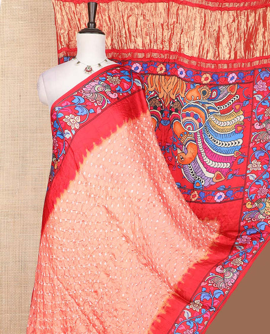 Peach bandhani dotted bandhani silk saree, contrast kalamkari floral vine and peacocks printed border of peacock printed pallu