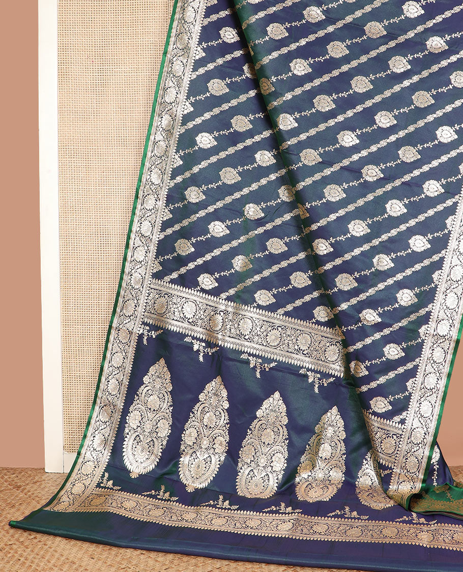 Blue jacquard banarasi silk saree, floral creeper design border, and pallu of Mughal-inspired intricate motifs