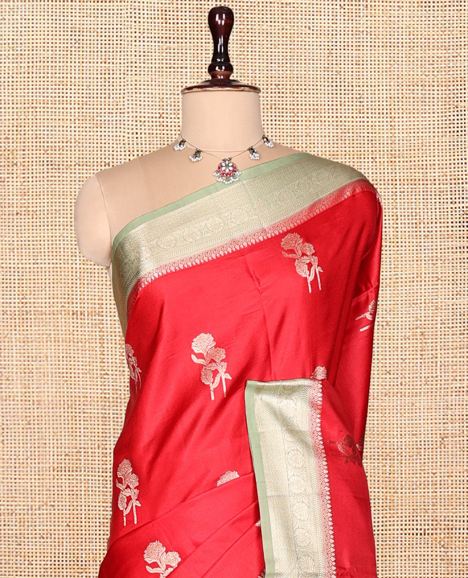 Red Satin Silk Saree, Spotlighted with Floral Buttas, Complemented by a Contrast Traditional Zari Border, Grand Jaal Pallu, and a Contrast Blouse