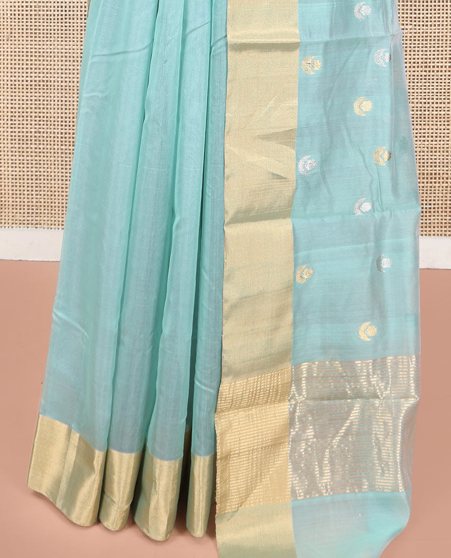 Blue Chanderi Cotton Saree, Gleamed Up with Floral Buttas All Over Its Body, Highlighted by a Bavanji Border, Pallu Steeped with Zari Stripes, and Paired with a Matching Blouse